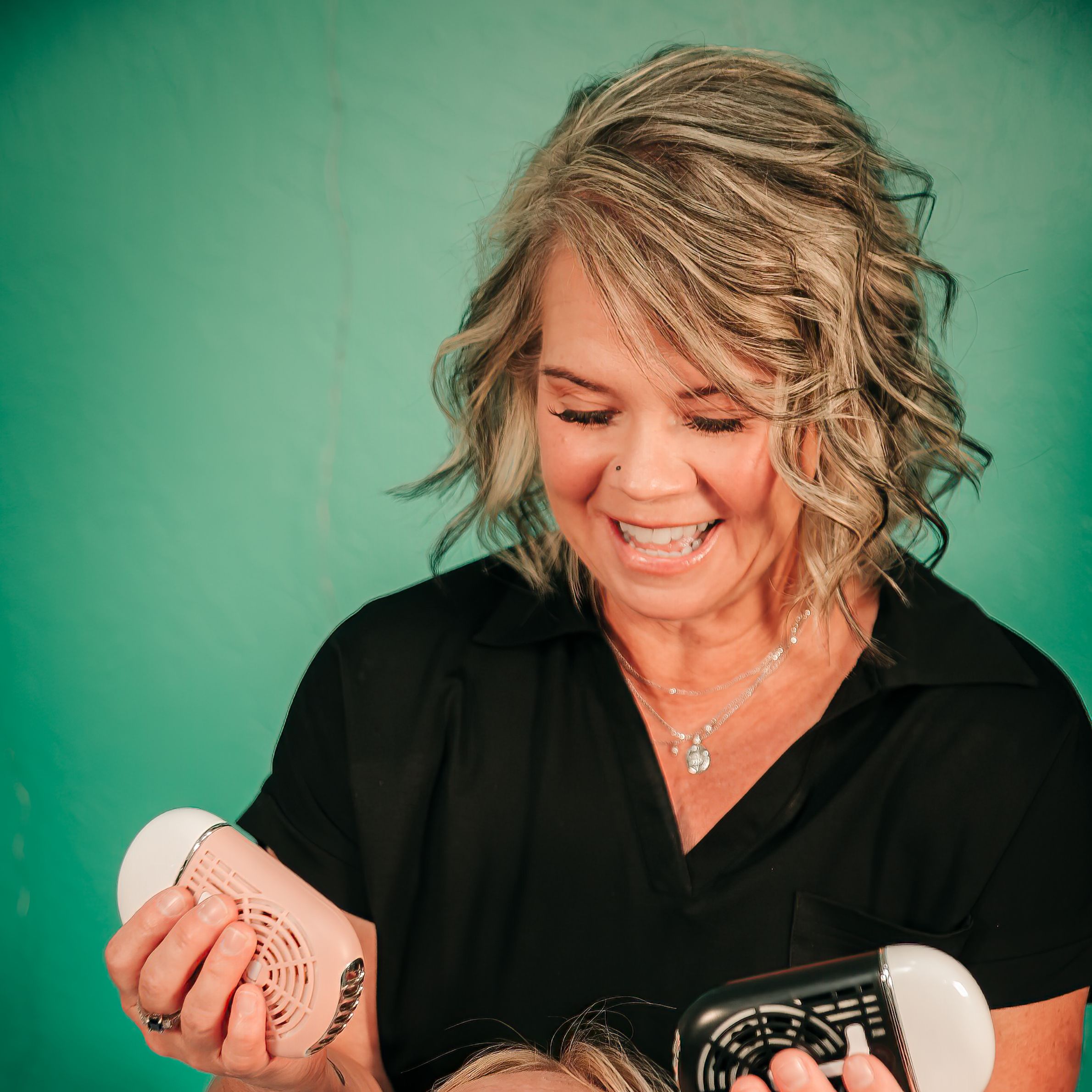 Woman using jade roller on face