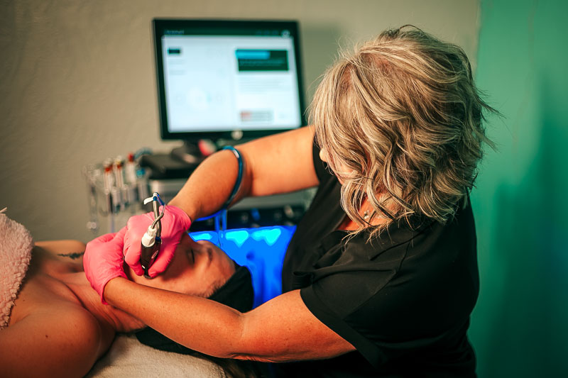 Woman receiving a luxurious facial treatment at a medical spa