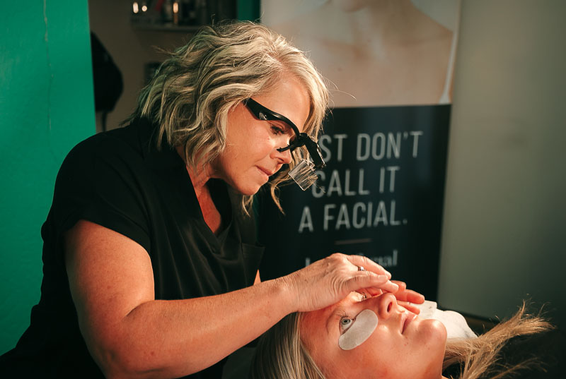Deanne performing a professional skin cleansing treatment